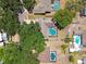 Aerial view features multiple homes each with private backyard pools and screened enclosures in a suburban neighborhood at 3041 Avalon Terrace Dr, Valrico, FL 33596