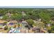 Aerial view of lush residential neighborhood featuring backyard pools with screened enclosures at 3041 Avalon Terrace Dr, Valrico, FL 33596