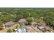 Picturesque aerial view of residential homes with private pools surrounded by lush trees at 3041 Avalon Terrace Dr, Valrico, FL 33596