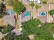 Aerial view showcasing multiple homes each featuring backyard pools with screened enclosures in a quiet neighborhood setting at 3041 Avalon Terrace Dr, Valrico, FL 33596