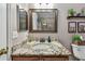 Bathroom featuring granite countertops, wood cabinets, and decorative mirror at 3041 Avalon Terrace Dr, Valrico, FL 33596
