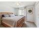 Cozy bedroom with neutral tones, a ceiling fan, and a large window at 3041 Avalon Terrace Dr, Valrico, FL 33596