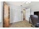This bedroom features a spacious closet and is furnished with a classic wooden bookcase at 3041 Avalon Terrace Dr, Valrico, FL 33596