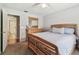 Bedroom with wood floors and a door to the bathroom at 3041 Avalon Terrace Dr, Valrico, FL 33596