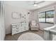 This bedroom features a soft color palette, with accents on white furniture and soft textures at 3041 Avalon Terrace Dr, Valrico, FL 33596