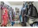 Walk-in closet equipped with rods and shelving for clothes and storage at 3041 Avalon Terrace Dr, Valrico, FL 33596