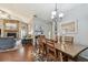 Open dining room with stone fireplace and adjacent living area at 3041 Avalon Terrace Dr, Valrico, FL 33596