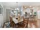 Bright dining room featuring wood table, chandelier, and hardwood floors at 3041 Avalon Terrace Dr, Valrico, FL 33596