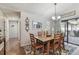 Dining room with chandelier, natural light, and sliding glass door to patio at 3041 Avalon Terrace Dr, Valrico, FL 33596
