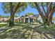 Charming single-story home with mature trees and landscaping in a well maintained yard at 3041 Avalon Terrace Dr, Valrico, FL 33596