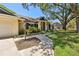 Charming single-story home boasts a beautifully landscaped front yard and covered entrance at 3041 Avalon Terrace Dr, Valrico, FL 33596