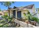 Charming single-story home boasts a beautifully landscaped front yard and covered entrance at 3041 Avalon Terrace Dr, Valrico, FL 33596