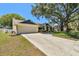 Charming single Gathering home with a well manicured front lawn and two car garage at 3041 Avalon Terrace Dr, Valrico, FL 33596