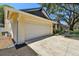 Spacious two car garage with concrete driveway and verdant landscaping at 3041 Avalon Terrace Dr, Valrico, FL 33596