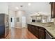 Open-concept kitchen with granite counters and stainless steel appliances at 3041 Avalon Terrace Dr, Valrico, FL 33596