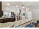 The kitchen features stainless steel refrigerator, granite countertops and dark cabinets at 3041 Avalon Terrace Dr, Valrico, FL 33596