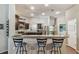 Kitchen featuring breakfast bar, stainless steel appliances, granite countertop and dark cabinets at 3041 Avalon Terrace Dr, Valrico, FL 33596