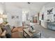 Open-concept living room boasts bright light, neutral colors, and inviting furniture at 3041 Avalon Terrace Dr, Valrico, FL 33596