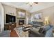 Cozy living room with stone fireplace, mounted tv, and comfortable seating at 3041 Avalon Terrace Dr, Valrico, FL 33596