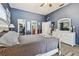 Comfortable main bedroom with ensuite bathroom, large closet, ceiling fan and neutral décor at 3041 Avalon Terrace Dr, Valrico, FL 33596