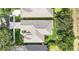 An aerial view highlighting the roof and landscaping of a single-Gathering home at 3119 Bent Creek Dr, Valrico, FL 33596