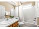 Bright bathroom features a shower-tub combo and neutral color palette, creating a soothing and functional space at 3119 Bent Creek Dr, Valrico, FL 33596