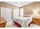 Bright bedroom featuring a comfortable bed and built-in closets at 3119 Bent Creek Dr, Valrico, FL 33596