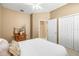 Well-lit bedroom with a ceiling fan and closet, providing a comfortable and functional living space at 3119 Bent Creek Dr, Valrico, FL 33596