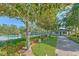 Beautiful clubhouse with paved walkway, lush landscaping, and a community pool nearby at 3119 Bent Creek Dr, Valrico, FL 33596