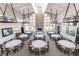 A spacious clubhouse featuring tables, chairs, and a decorative stone fireplace at 3119 Bent Creek Dr, Valrico, FL 33596