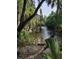 Scenic view of a stream surrounded by lush greenery and trees, highlighting the natural beauty at 3119 Bent Creek Dr, Valrico, FL 33596