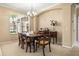 Traditional dining room with a wooden table, upholstered chairs, and buffet; bathed in natural light at 3119 Bent Creek Dr, Valrico, FL 33596