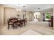 Formal dining area with elegant chandelier, wood table, and seamless flow into the living spaces at 3119 Bent Creek Dr, Valrico, FL 33596