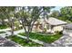 Charming single-Gathering home with well-kept lawn, mature trees, and a two-car garage at 3119 Bent Creek Dr, Valrico, FL 33596