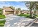 Inviting single-story home featuring a well-manicured lawn, two-car garage, and a long driveway at 3119 Bent Creek Dr, Valrico, FL 33596