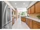Spacious kitchen featuring stainless steel appliances, tile flooring, and wood cabinets at 3119 Bent Creek Dr, Valrico, FL 33596