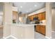 Open kitchen with a breakfast bar, stainless steel appliances, and tile backsplash at 3119 Bent Creek Dr, Valrico, FL 33596