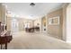 Bright, open-concept living room with ample natural light, neutral tones, and formal dining area at 3119 Bent Creek Dr, Valrico, FL 33596