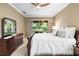 This main bedroom offers a serene retreat with lots of closet space, and private access to the screened-in lanai at 3119 Bent Creek Dr, Valrico, FL 33596