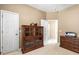 Office with a display cabinet and neutral walls creates a dedicated workspace in your home at 3119 Bent Creek Dr, Valrico, FL 33596