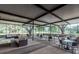 Open patio area with chairs and tables, offering a comfortable outdoor dining space at 3119 Bent Creek Dr, Valrico, FL 33596