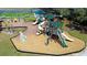 Aerial view of a playground featuring climbing structures, slides, and swings for community children at 3119 Bent Creek Dr, Valrico, FL 33596