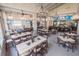 A spacious restaurant featuring a bar, multiple tables, and wall-mounted TVs at 3119 Bent Creek Dr, Valrico, FL 33596