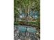 Relaxing backyard view with inviting chairs overlooking a serene canal at 3133 Pineview Dr, Holiday, FL 34691