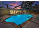 A beautiful pool area with a screened-in enclosure and ample space for lounging and entertaining at 3133 Pineview Dr, Holiday, FL 34691
