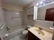 Bathroom featuring white tiled shower, toilet, and vanity at 3655 Dellefield St, New Port Richey, FL 34655
