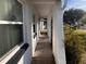 Exterior image of the white exterior and covered walkway of the home at 3655 Dellefield St, New Port Richey, FL 34655