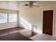 Bright living room featuring hardwood flooring and natural light from large windows at 3655 Dellefield St, New Port Richey, FL 34655
