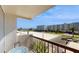 Enjoy beautiful views from this balcony, perfect for relaxing and entertaining with table and plants at 400 Island Way # 210, Clearwater Beach, FL 33767