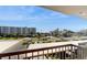 Enjoy the view from this comfortable balcony overlooking the neighborhood and lush landscaping at 400 Island Way # 210, Clearwater Beach, FL 33767